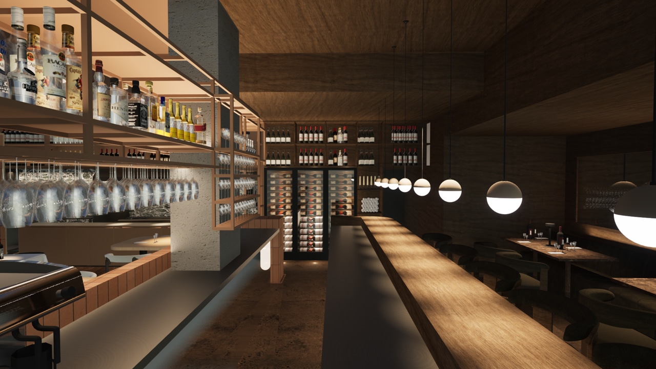 De bar van CARBŌ bij avond, met lage lampen boven het hout